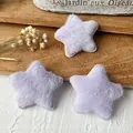 Three lavender plush star accessories for DIY crafts on a rustic wooden tray - Purple Star