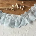 Macro detail of light blue pleated cotton lace trim with embroidered heart pattern - Light Blue Zircon