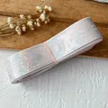 Close-up of pink gradient ribbon with silver magic circle patterns for DIY craft - Light Pink Plain Silver Magic Bottle 4.5 Meters Long And Approximately 2.5 Cm Wide.
