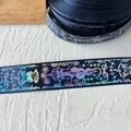 Macro view of dark blue ribbon with holographic snake and floral patterns for DIY decor - Snake King (Silver Pattern) / Navy Blue