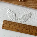 Pair of white embossed angel wings for DIY crafts with detailed feather texture - No.7 Non-Plush Angel Wings / White