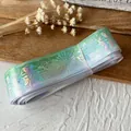 Holographic green gradient ribbon roll with rose and emblem patterns for DIY decor - Clear Cyan