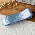 Light blue grosgrain ribbon featuring holographic laser moon and star magic patterns - Standard Roll / Baby Blue With Silver Holographic