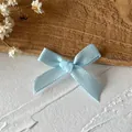 Handmade light blue satin ribbon bow with woven texture for DIY hair accessories and gifts - Blue Bow