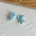Light blue satin ribbon bow applique for DIY sewing with delicate scalloped edges - Blue Bow Patch
