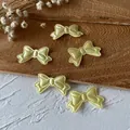 Five light yellow satin ribbon bows for DIY hair accessories and garment decoration - Yellow Bow Patch