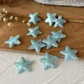 Light blue padded fabric star applique with stitched edges for DIY crafts and sewing - Blue Star Patch