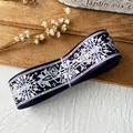 Deep purple ribbon roll with white rose and geometric patterns for DIY crafting - Magic Purple