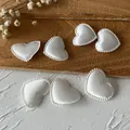 Set of seven white heart-shaped fabric patches with beaded edges for DIY sewing projects - White Tiny Heart