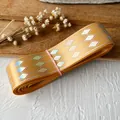 Golden satin ribbon with holographic silver diamond pattern for DIY crafts and decor - Orange Silver
