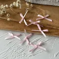 Handgefertigte kleine hellrosa Satinschleifen für DIY-Bastelarbeiten und Kleidung - Mini-Schleife / 10 Stück/Packung (Bandbreite 0,3 cm) / Rosa