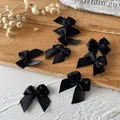 Set mit sieben handgefertigten schwarzen 2,5 cm Schleifen für DIY-Haarschmuck und Kleidung - Breite Schleife / 10 Stück/Packung (Bandbreite 1 cm) / Schwarz