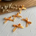 Fünf handgefertigte orangefarbene Satinbandschleifen für DIY-Haarschmuck und Kleidung - Mini-Schleifenhalskette / 10 Stück/Packung (Bandbreite 0,6 cm) / Orange