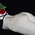 Champagne floral lace open crotch panties on model with a romantic red rose - Nude
