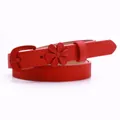 Slim red faux leather belt for women featuring a vintage floral buckle and stitched edges - Red