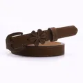 Slim dark brown belt for women featuring a minimalist resin flower buckle accent - Coffee