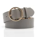 Grey minimalist leather belt for women featuring a large circular golden metal buckle - Gray