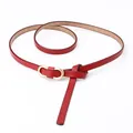 Elegant thin red genuine leather belt for women featuring a gold oval metal buckle - Red
