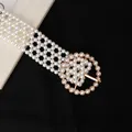 Elegant woven pearl waist chain for dresses featuring a round gold buckle with pearls - Round Buckle Style (8138)