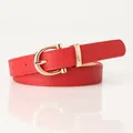 Women's thin red leather belt with a gold D-ring buckle and lychee texture - Red