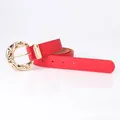 Women's red leather belt with an irregular textured golden round metal buckle - Red