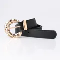 Classic black leather belt for women featuring a stylish hammered gold metal buckle - Black