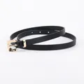 Minimalist black slim leather belt for women featuring a polished gold rectangular buckle - Black