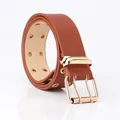 Brown faux leather double-grommet belt with gold buckle and mirror reflection - Camel