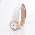 White synthetic leather belt for women featuring a gold round buckle and woven details - White