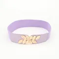 Women's purple elastic waist belt featuring a decorative golden metal leaf buckle - Purple