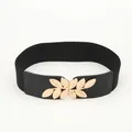 Women's wide black elastic belt featuring an elegant gold metal leaf buckle design - Black