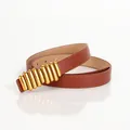 Women's minimalist brown leather slim belt featuring a cylindrical gold buckle design - Camel