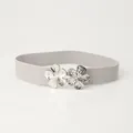 Women's grey elastic waist belt featuring a silver metallic floral buckle with petals - Gray
