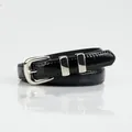 Women's minimalist black patent leather belt featuring a polished silver metal pin buckle - Black