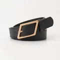 Minimalist black leather belt for women featuring a polished gold geometric metal buckle - Black