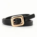 Slim black leather belt for women featuring a polished gold square buckle and litchi texture - Black