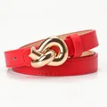 Red leather belt for women featuring a gold knot buckle and cross-hatch texture - Red
