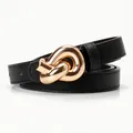 Women's black faux leather belt featuring a textured Saffiano finish and gold knot buckle - Black