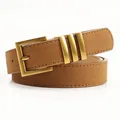 Brown suede belt with gold needle buckle and three decorative metal loops - Camel
