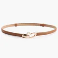 Slim brown leather belt for women with a polished gold heart-shaped buckle design - Camel