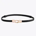 Slim black leather belt for women featuring a minimalist double-ring gold interlocking buckle - Black