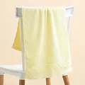Close-up of soft yellow cotton towel with waffle texture and geometric pattern - 35*75cm / Checkered Light Yellow Towel