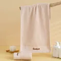 Absorbent apricot cotton face towel featuring elegant floral embroidery and soft texture - 74cmx34cm / Brown