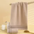 Absorbent khaki cotton face towel featuring decorative grey stripes and plush texture - 75x35cm / Light Coffee