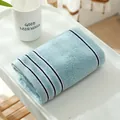 Soft light blue cotton hand towel featuring navy striped border and terry texture - 74cmx34cm / Green