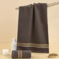 Absorbent cotton towel set in dark brown featuring elegant striped edge details - 75x35cm / Dark Satin Brown