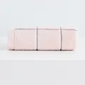 Soft pink cotton face towel with grey minimalist check pattern in a rolled display - Pink
