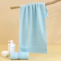 Absorbent light blue pure cotton towel with jacquard stripes on a wooden rack - 74*34cm / Blue