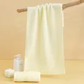 Soft absorbent cotton towel in light yellow with elegant satin border design - 74*34cm / White