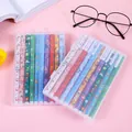Christmas themed multicolor 10-piece gel pen set in clear case on pink desk background - Christmas Themed Multi Color Set